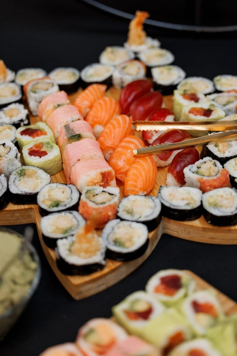Sushi platter with assorted maki rolls and nigiri on a wooden board