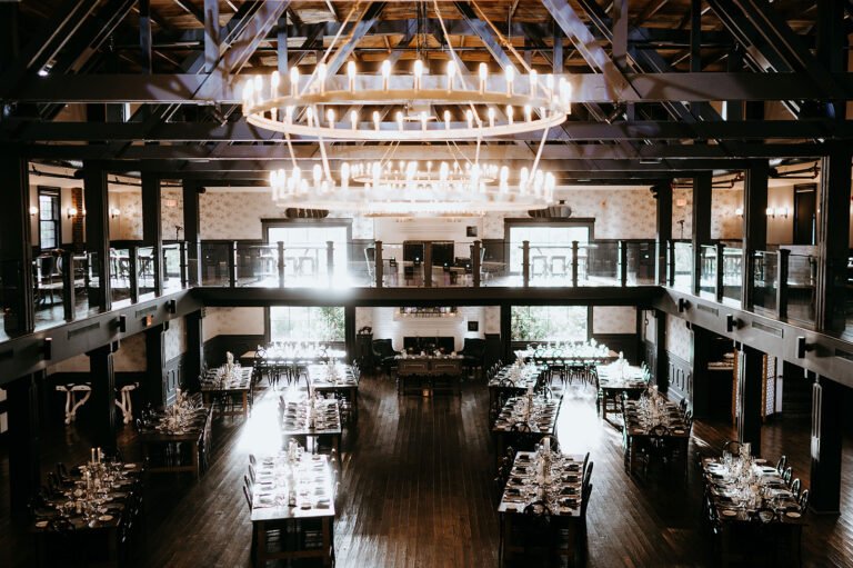 Park Loft dance hall with ring chandeliers, the wraparound mezzanine and reception tables below