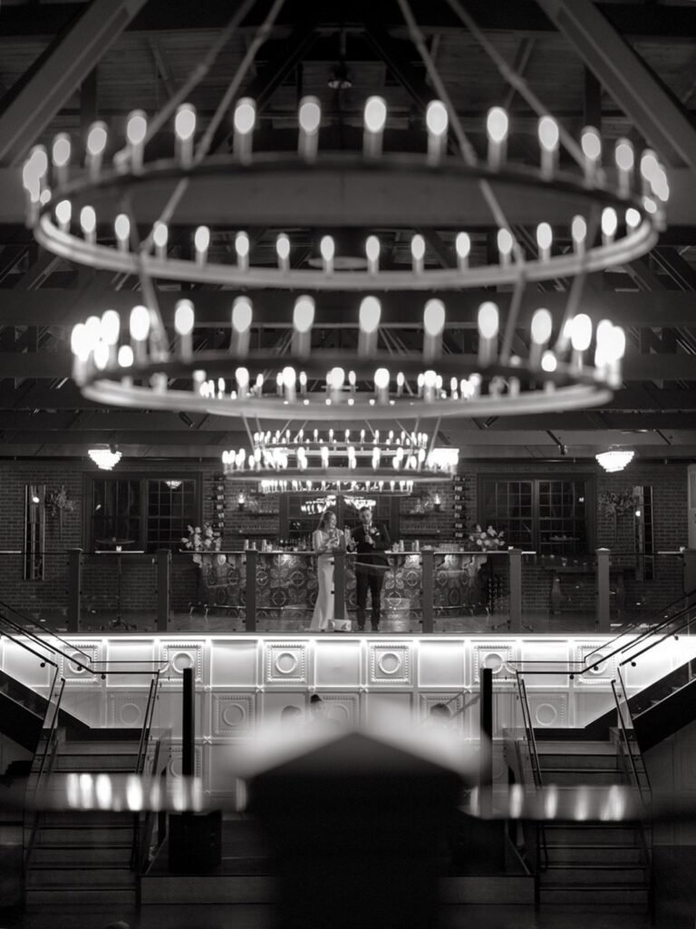 Black-and-white view of a two-tier ring chandelier above the Park Loft dance hall