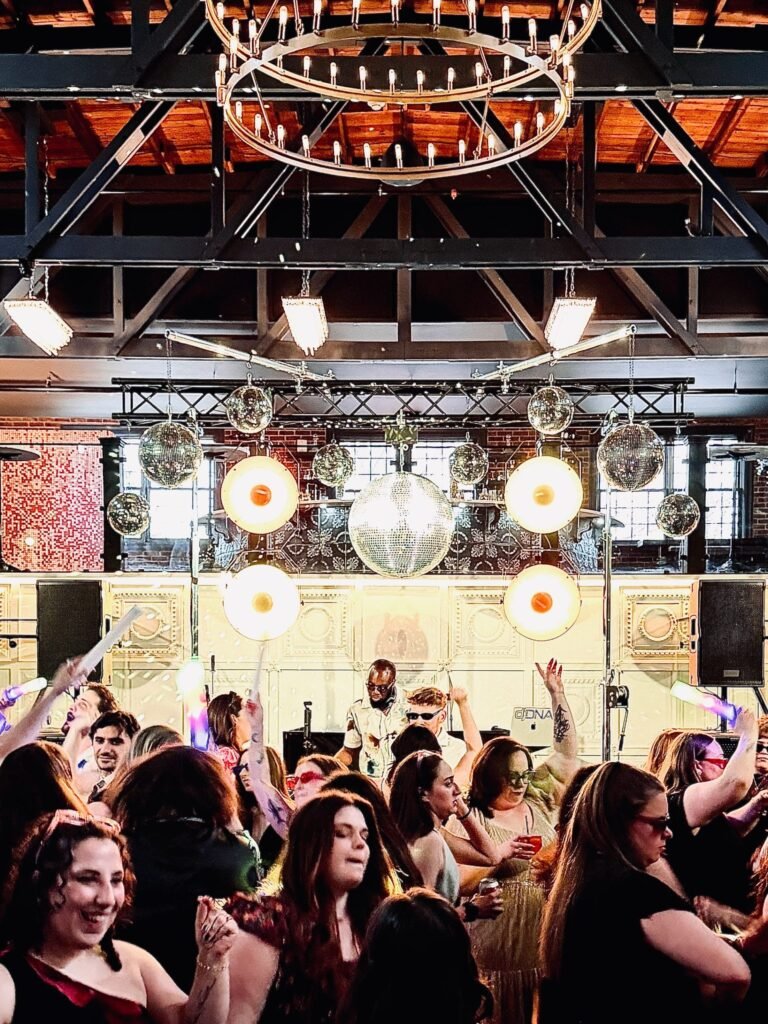 Guests dance in front of the stage and a live band in the Park Loft dance hall
